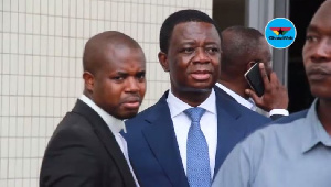 Dr. Stephen Opuni (blue suit) has been accused of causing financial loss to the state