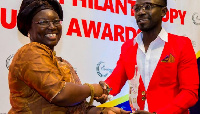 Okyeame Kwame receiving 