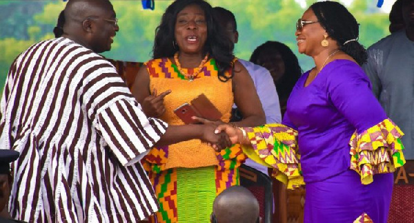 Dr Bawumia shake hands with Charlote Osei while Catherine Afeku looks on