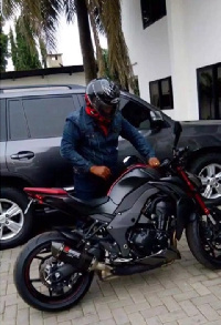 Former  President John Dramani Mahama with his motorbike