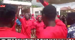 Wearing red and chanting war songs, they demanded an apology