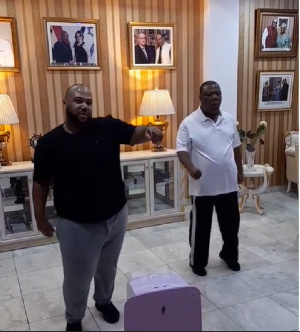 Father and son doing a work out routine together.