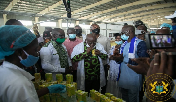 President Nana Akufo-Addo sipping Eku juice at the factory