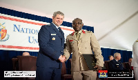 Gen Michael T Plehn, President of  NDU in a handshake with Col Isaac Amponsah