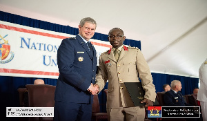 Gen Michael T Plehn, President of  NDU in a handshake with Col Isaac Amponsah