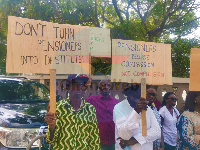 Some pensioners holding placards