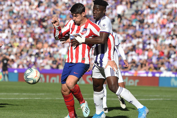 Ghana international Mohammed Salisu tackling Atletico Madrid striker Alvaro Morata