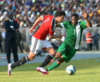 Egypt's Mahmoud Trezegate takes on Nigeria forward, Ahmed Musah