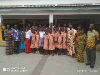 Some staff of the school in a group photograph with some students of the school