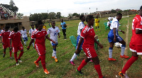 Ashtown ladies in red and Kumasi Sports Acadamy in white and blue