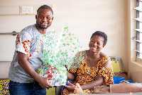 A mother receiving a hamper