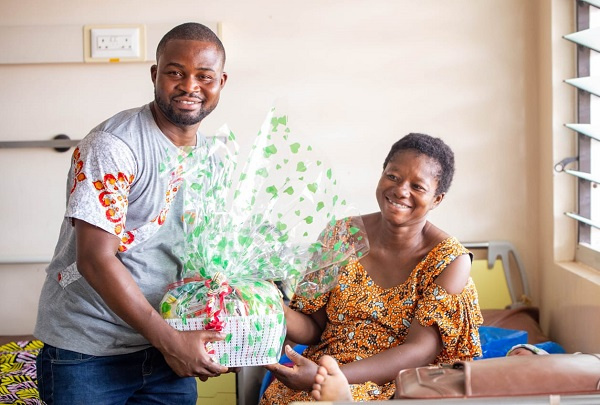 A mother receiving a hamper