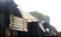 Fire fighter douse Koforidua central market fire