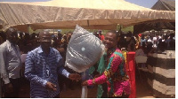 Awudu Kombian (R) receiving his reward