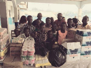 Sayvee in a group photograph with some of the orphans