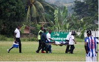 Nathaniel Asamoah being stretched off in the game against Dreams FC