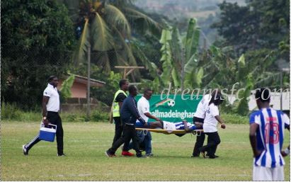 Nathaniel Asamoah being stretched off in the game against Dreams FC