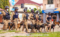 Some police personnel of K-9 Unit with their highly trained dogs [Credit: Ghana Police Service]