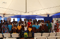 Pupils, teachers, some parents with management of the company in a group photograph