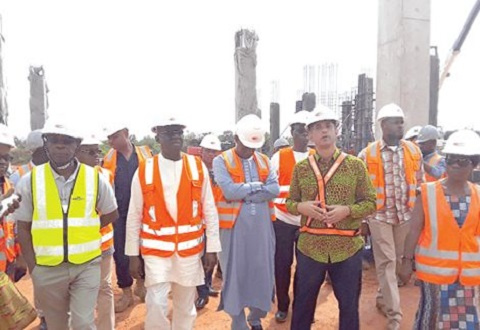 Mr Jorge Tavares de Almeida (4th L) taking Mr Kofi Adda (2nd L) and his entourage round the project