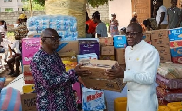 Alban Bagbin hands over a donation to the leader of the orphange