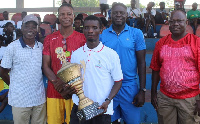 Benjamin Fumi holds the trophy with pride