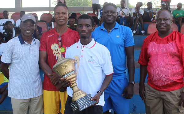 Benjamin Fumi holds the trophy with pride