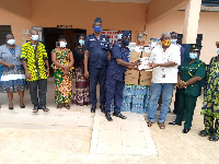 Some officials of Akuse Prisons receiving items to aid the fight against Coronavirus