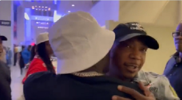 Ghanaian dancehall star Shatta Wale in a hug with  American rapper Ja Rule