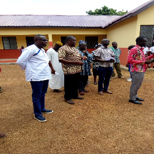 Representatives of the district hand over the six unit classroom block with an office complex