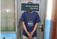 Suspect Ali Awudu in police custody