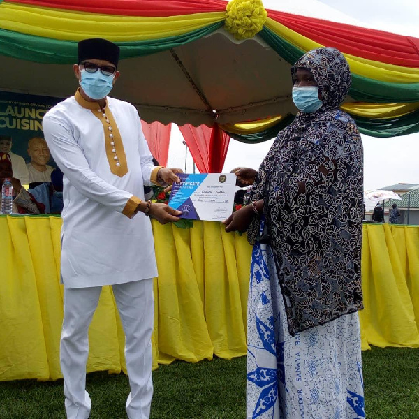 Mustapha Hamid handing over one of the certificates