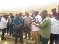 Dr Cassiel Ato Forson addressing the gantering affected by the dam spillage in the Volta Region