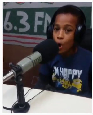 Young boy in the studio of Peace FM