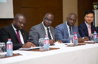 CEO of the Universal Merchant Bank, John Awuah and some government representatives during the signin