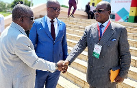 Mr Kan-Dapaah (left) exchanging pleasantries with some participants