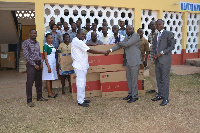 Team from GCB presents TV sets to officials of the hospital