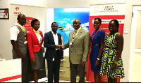 Business executives from Airtel Ghana and Africa World Airlines in a handshake