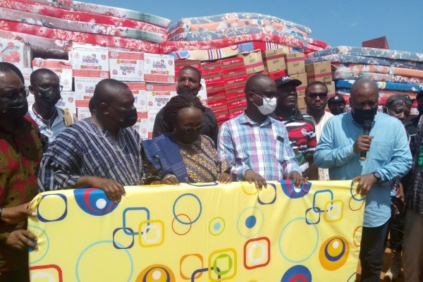 President Mahama (right) makes a donation in Keta