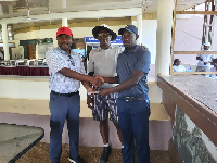 Kojo Barnni receiving the trophy