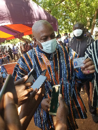 John Dramani Mahama with his ID card