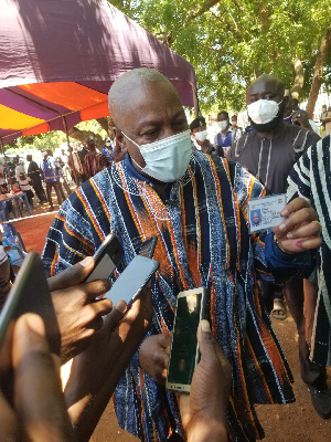 John Dramani Mahama with his ID card