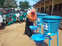 Students being taught how to wash their hands properly (file photo)