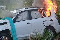 The car was set ablaze by angry residents shortly after the accident