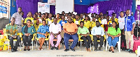 Municipal Director, CHRAJ at Weija-Gbawe Municipal Office in a group photo with students