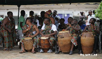 File Photo: A group of people drumming and dancing