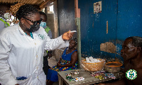 One of the public health officers at one of the public toilets in Accra