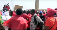 Demonstrators holding placards