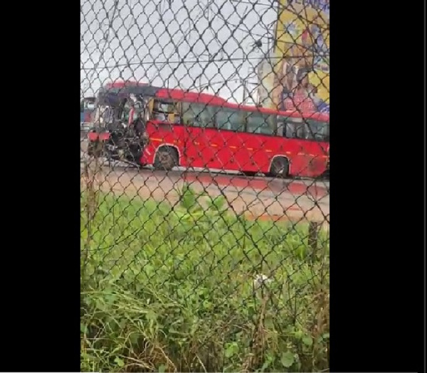 The bus sits in the middle of the road towards Tema from Accra