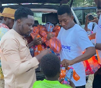 ABD Traore and his staff handing out food packages to the beneficiary